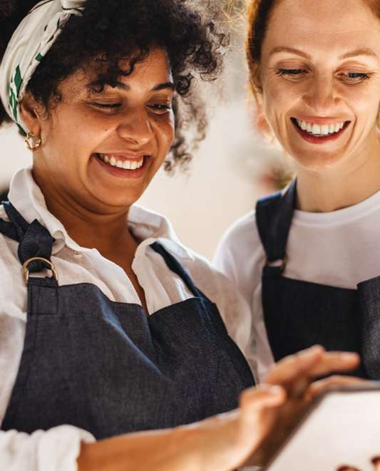 Local merchants reviewing offers on a tablet