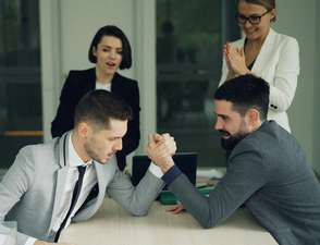 Colleagues competing playfully in an office